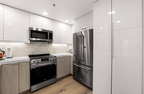 Airport Area Condo | Ultra Lux Oasis in Gated Community