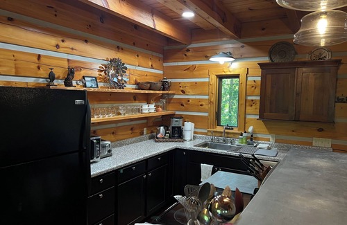 Twelve Mile Cabin | Unique Log Cabin Retreat on 138 Acres, swim, fish, boat, paddleboard, kayak!