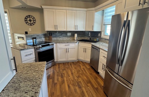Milwaukee House | Updated 2BR, 2.5BA. Hot tub, fenced in yard, modern updates.