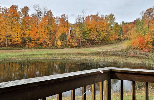 Ludlow Condo | Updated condo with water views, fireplace, ski-in/out, washer/dryer, & tennis