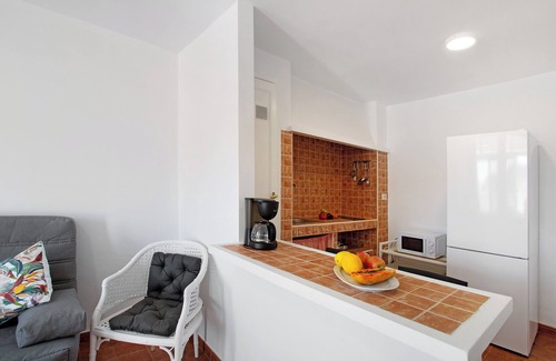 Puerto Rico Apartment | Vacation Apartment 'Appartamento Timo' with Sea View, Shared Pool and Wi-Fi