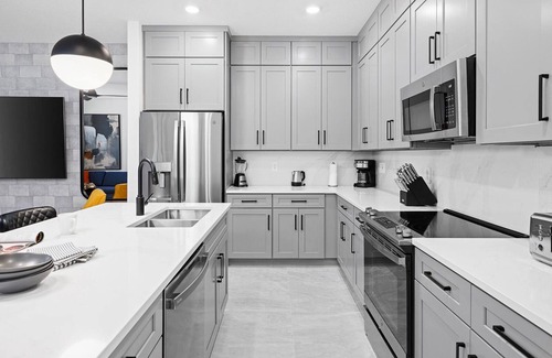 Florida Center House | Violet's Vista | Luxe home next to Universal w/spa pool, grand LR/DR, themed BR