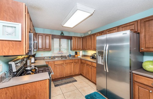 Ono Island Condo | VRBO Rated #1 Sandy Key 424 Includes ground floor storage with chairs & umbrella
