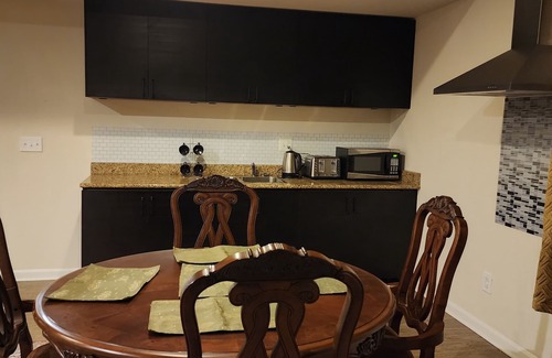 Triangle House | Walk in sunny furnished basement with 2 bedrooms and 2 bathrooms