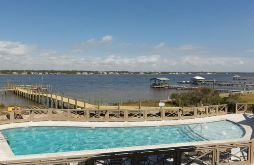 Gulf Shores Condo | WATER FRONT! Beach Access! Pool! Private dock