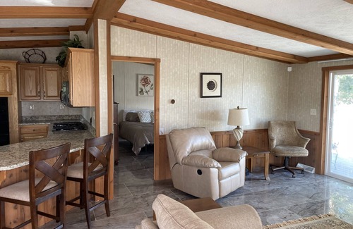 Galloway Cabin | Waterfront Bungalow nightly panoramic view of our illuminated covered Bridge