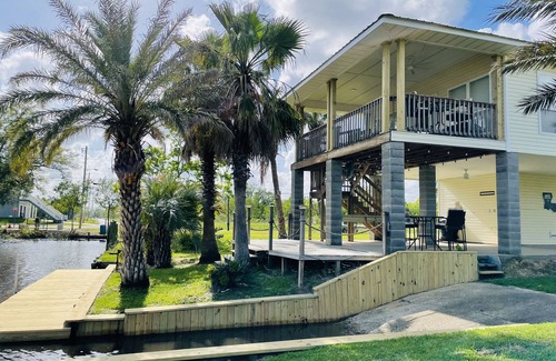 Shoreline Park House | Waterfront Camp in Jourdan River Estates