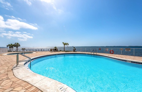 Ono Island Condo | Waterfront condo with beach access, pools, balcony, central AC, & W/D