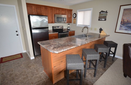 Lake Ozark Condo | Waterfront Condo with Walk-Out to Pool & Lake! Beautiful Inside! Electric Grill!