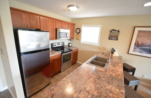 Lake Ozark Condo | Waterfront Condo with Walk-Out to Pool & Lake! Beautiful Inside! Electric Grill!