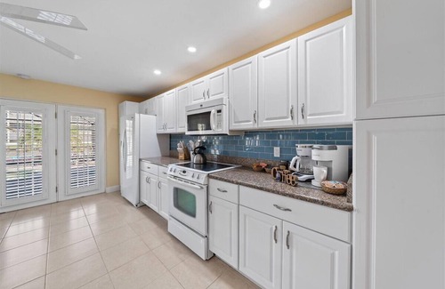 Cocoa Isles House | Waterfront-Heated Pool-Hottub-4bd-2BA-Paddle boat- Kayaks