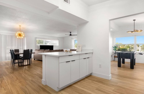 Apollo Beach House | Waterfront Home w/Private Dock, Hot Tub, Kayaks, Paddleboards, Games
