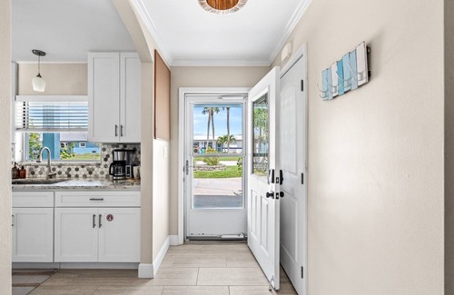 Convair Cove House | Waterfront Home with Heated Pool & Spa | Dock | 4.5 Blocks to Beach & Downtown