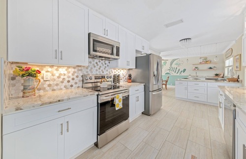 Convair Cove House | Waterfront Home with Heated Pool & Spa | Dock | 4.5 Blocks to Beach & Downtown