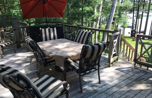 Lac du Flambeau House | Waterfront Lake Lodge with fireplace: Sleeps 10. Pets Ok. Fall Pontoon Specials!