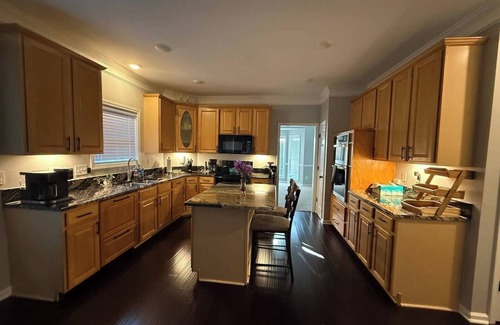 Greensboro House | Welcome to The Clover, a spacious 2-story vacation home that blends charm with modern comfort. Perfect for families, friends, or groups, this cozy retreat features inviting living spaces, a fully equipped modern kitchen & comfortable bedrooms.