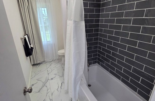Windsor Locks House | Welcome to The Hangar, a newly remodeled travel-themed stay, 4 minutes from BDL.