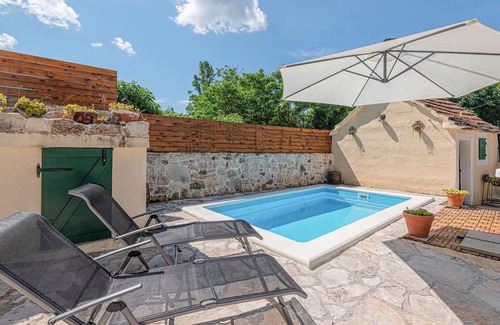 Drnis House | Welcome to this charming and traditional holiday home with pool in a delightful landscape.