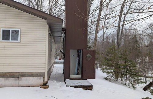 Skanee House | Welcoming off the Grid 2-bedroom Cabin in Skanee. On the Big Huron River.