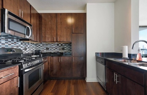 Downtown Chicago Apartment | West Loop Luxe 2BR: Balcony, Skyline Views