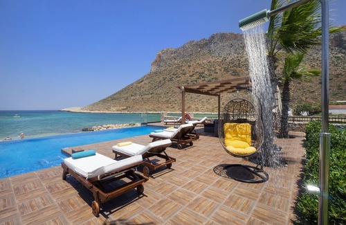 Stavros Villa | When the pool touches the sea.In front of the beach Antony Quinn danced syrtaki!