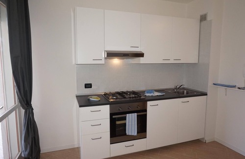 Lignano Sabbiadoro Apartment | White Black - Large one room apartment