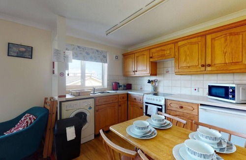 Hayle Cottage | Winray is set in a quiet spot on a grassy bank, accessible via several stone steps