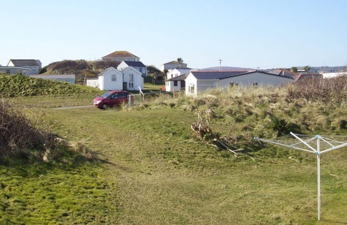 Hayle Cottage | Winray is set in a quiet spot on a grassy bank, accessible via several stone steps