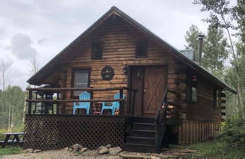 Dolores Cabin | Wolf Den Cabin is cozy and rustic that overlooks the beautiful aspens trees.