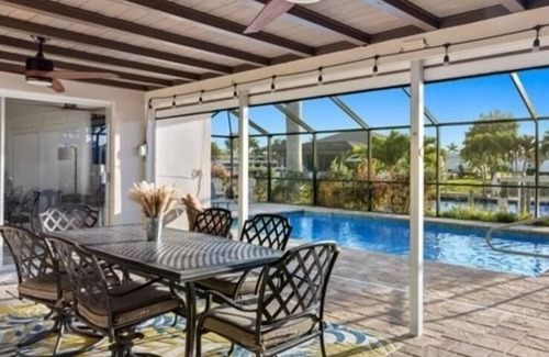 Yacht Club House | Yacht club area of Cape Coral w/Saltwater Pool, Dock & Theater Room