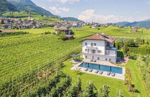 Tramin Apartment | "Zwerger Süden" vacation apartment with balcony, pool and large sunbathing lawn