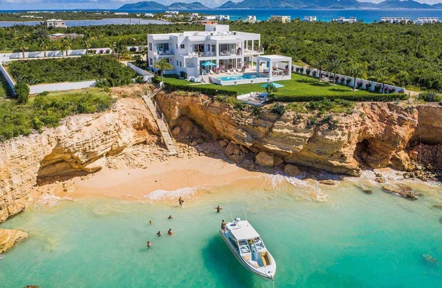 10,000 square feet of exquisite modern living with direct beach access