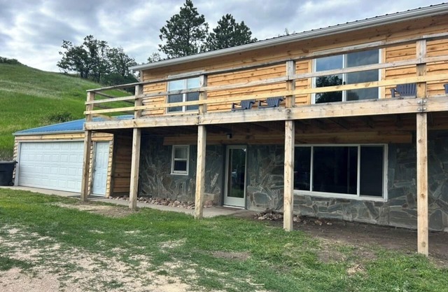 2-bedroom, 1 bathroom log cabin Bottom floor offers the perfect retreat close to downtown Sturgis. With breathtaking views and a peaceful wooded setting, this cozy home-away-from-home. Comfortably accommodating up to 6 guests.