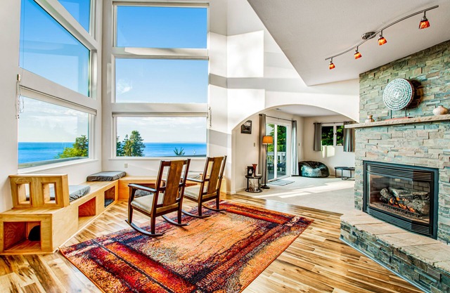 2-story inviting home with water & mountain views, deck, & gas fireplace