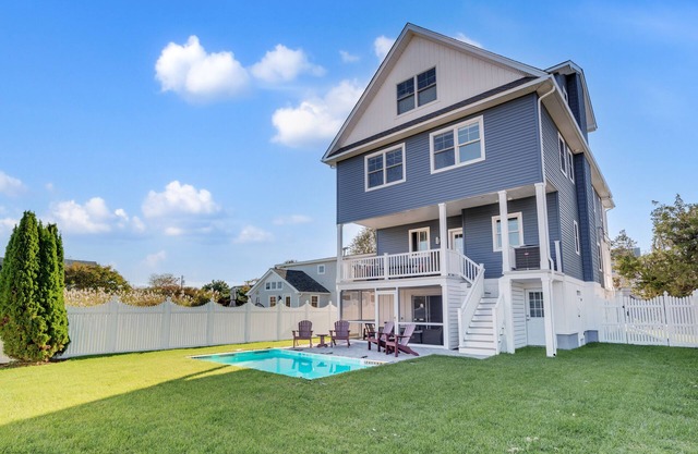 3 levels with 5 bedrooms, 4.5 baths, elevator, heated pool, and lots of gathering spaces both inside and out!