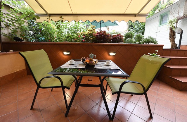 a house with many outdoor spaces in the center of rome.