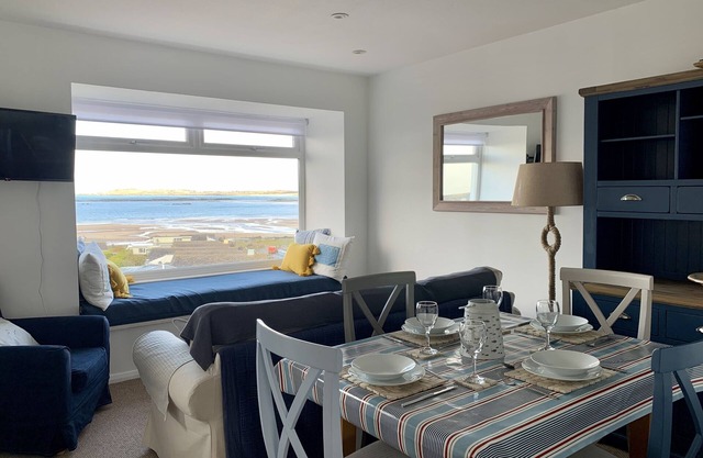 A top floor seaside apartment sleeping 5 in 2 bedrooms with panoramic sea views.