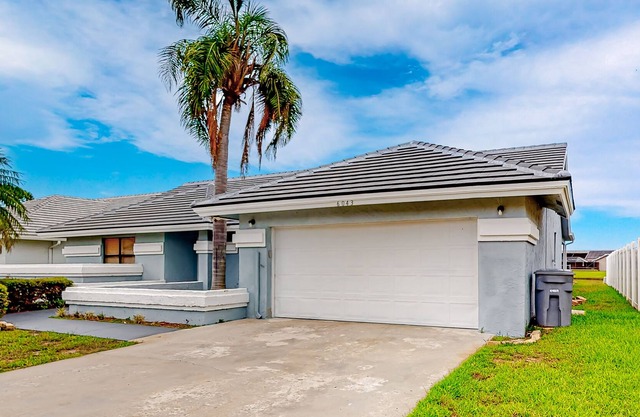 Airy home with pond views, private pool, game room, and dog-friendly