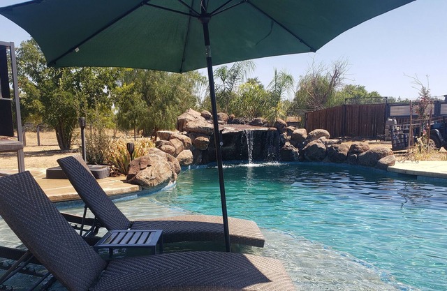 Althea House features a pool, firepit, grilling station, and friendly goats!