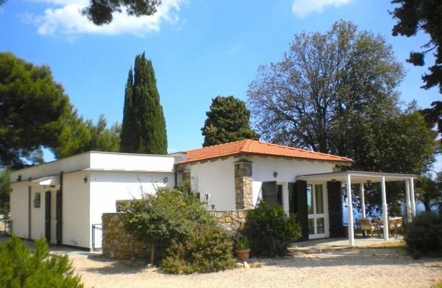 an island of peace with amazing sea wiew, among palms, pines, and olive trees