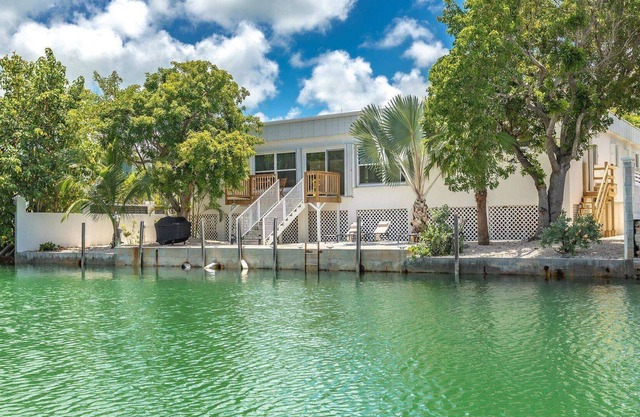 Atreo: Your Updated Canal Home with Interior Courtyard, Dockage & Dog-Friendly on Big Coppitt Key!