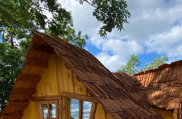 Atypical enchanted wooden cabin and heated outdoor pool