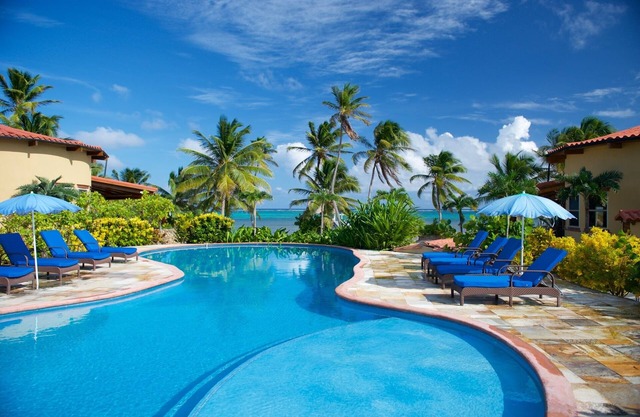 Be right on the beach with a designer pool and your own tennis/pickleball court!