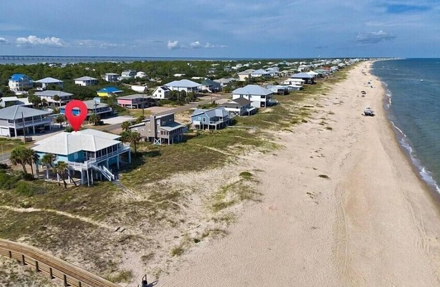 Beach front, screened porch, elevator, and pet friendly!