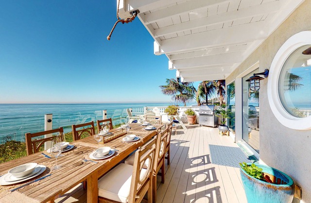 Beachfront Paradise with an Expansive Deck, Balcony, Amazing Views, & Free WiFi
