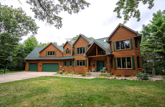 Beautiful 8000 Sq. Ft. Log Home With 250 Feet Of Private Frontage on Kusel Lake