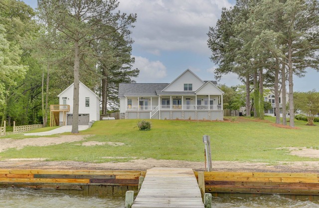 Beautiful river house with dock and boat house
