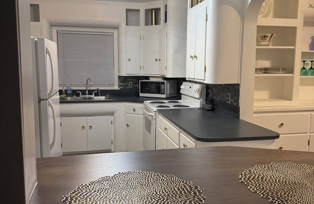 Beautifully restored, fully furnished 3 bedroom home one block from downtown