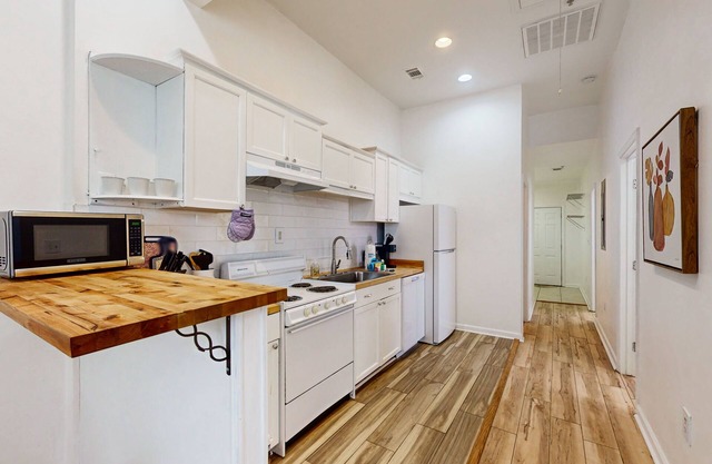 Boho duplex in a great location with smart TVs, well-equipped kitchen, W/D, & AC