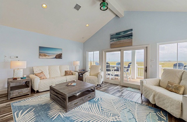 Bright and spacious home steps from the sand w/Shared Pool & Private Balcony